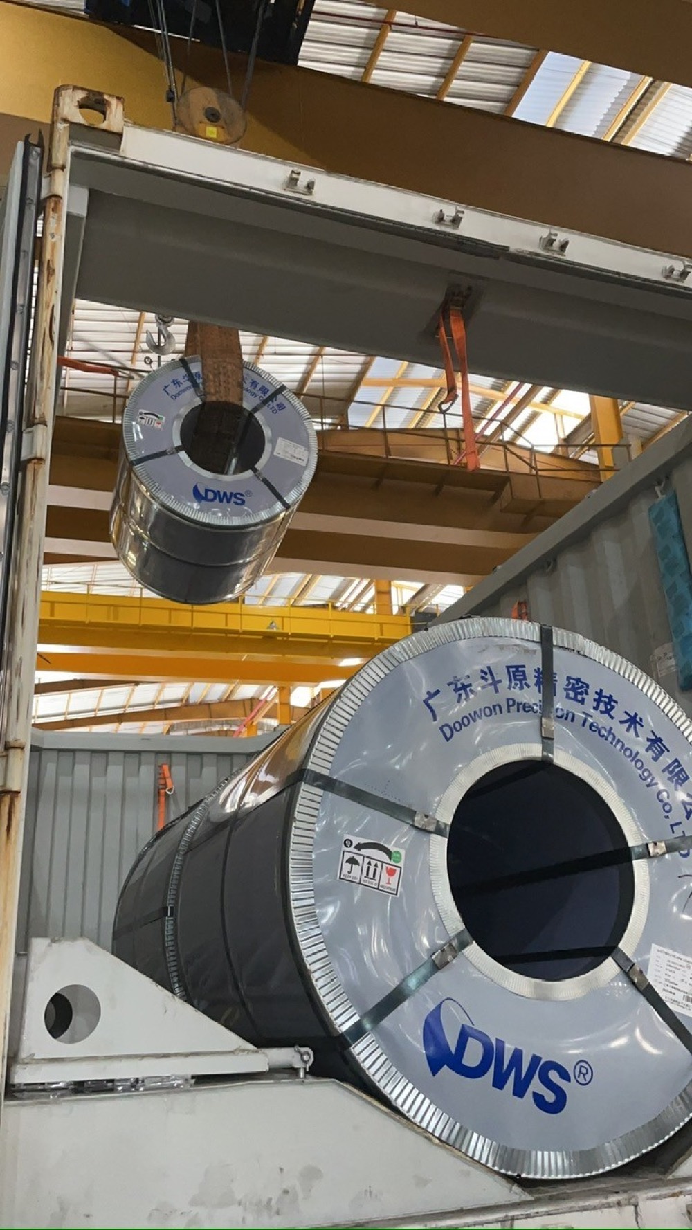 Steel coil being craned onto a truck